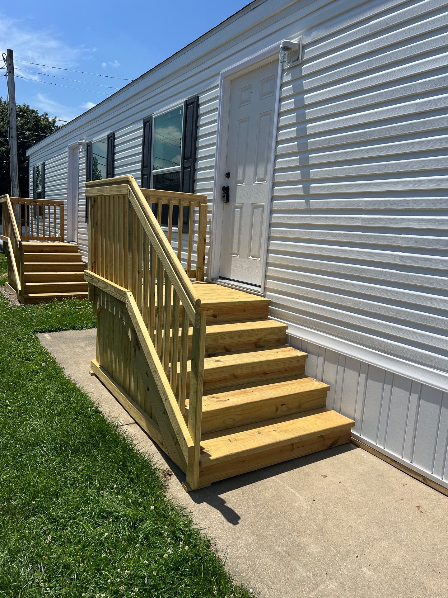 Crew securing a manufactured home